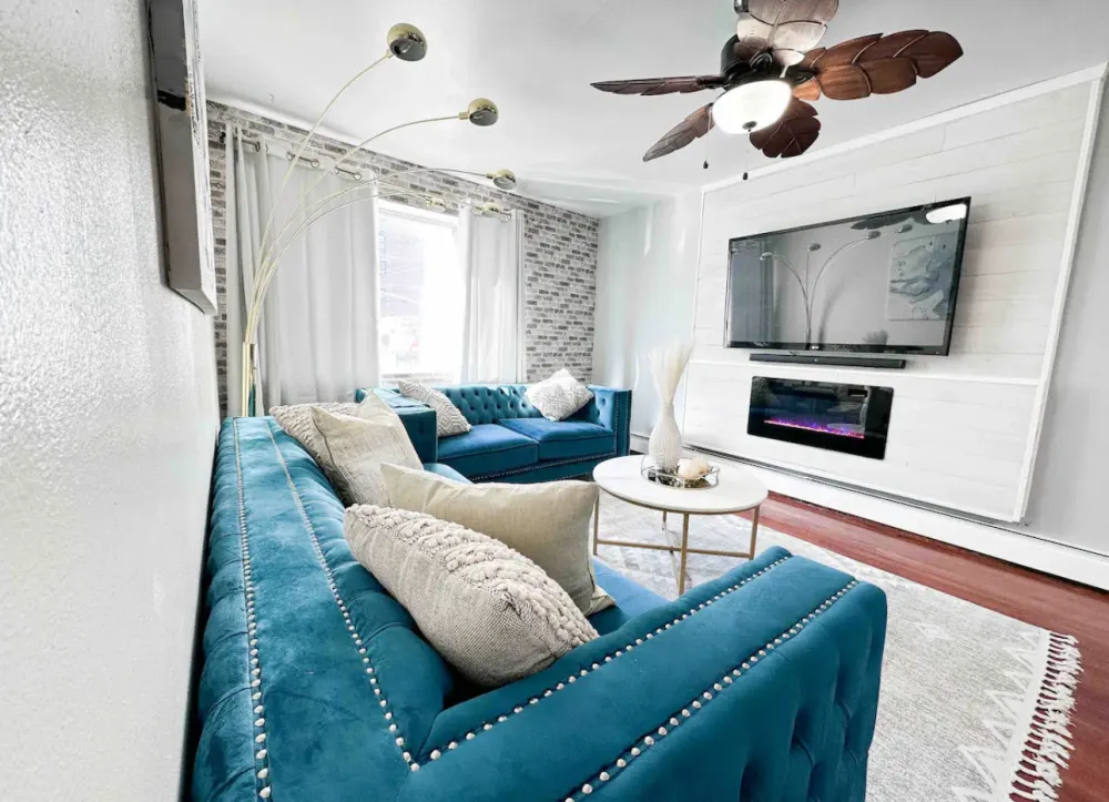 Stylish living room with blue sofas.