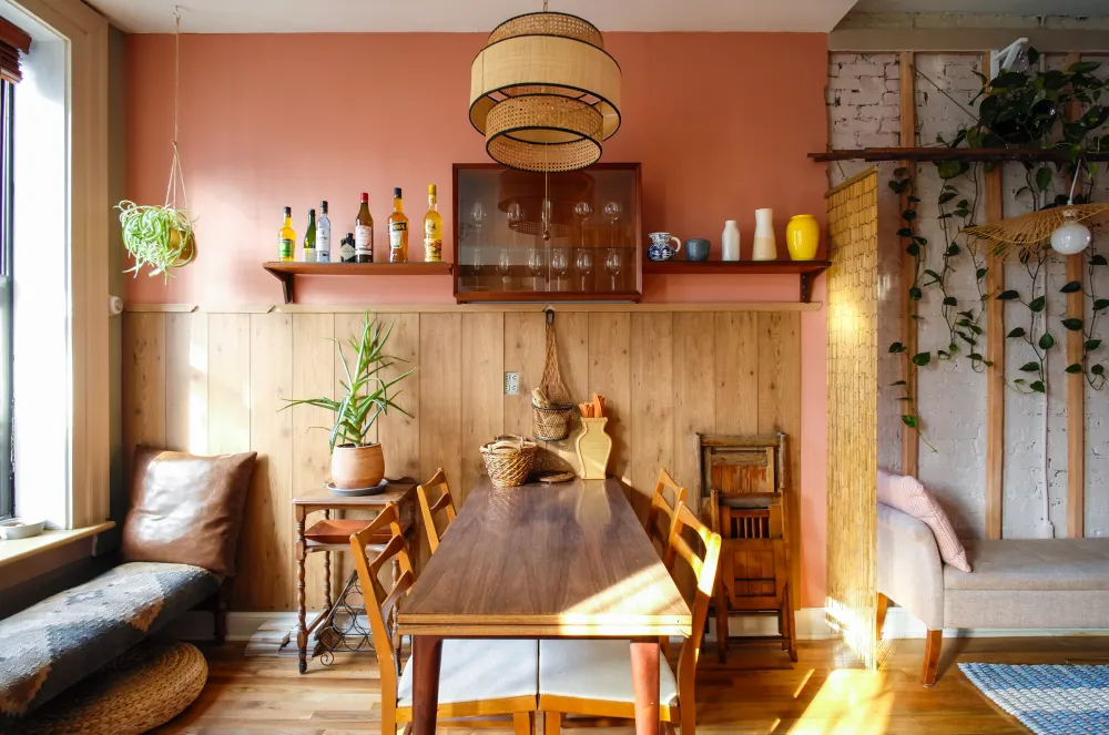 Cozy dining area with plants.