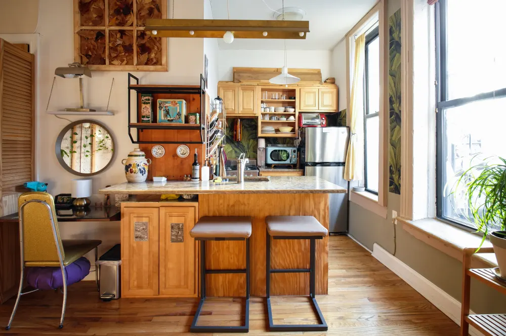 Cozy kitchen with bar stools.