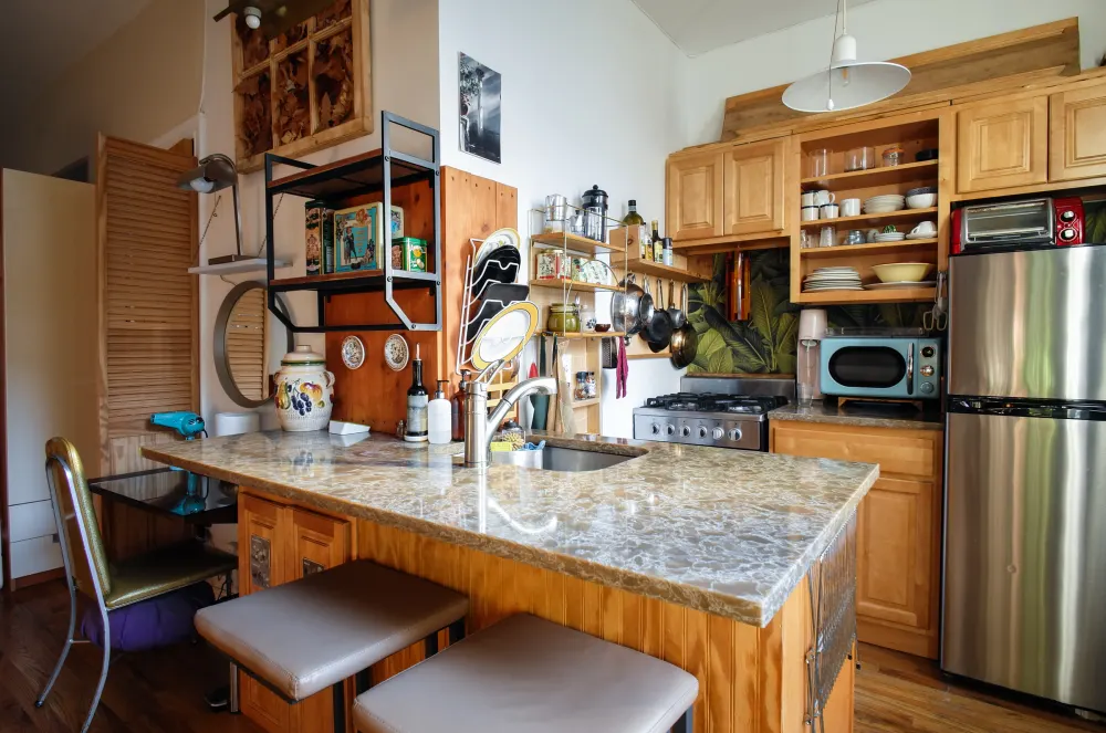 Cozy kitchen with marble countertop.