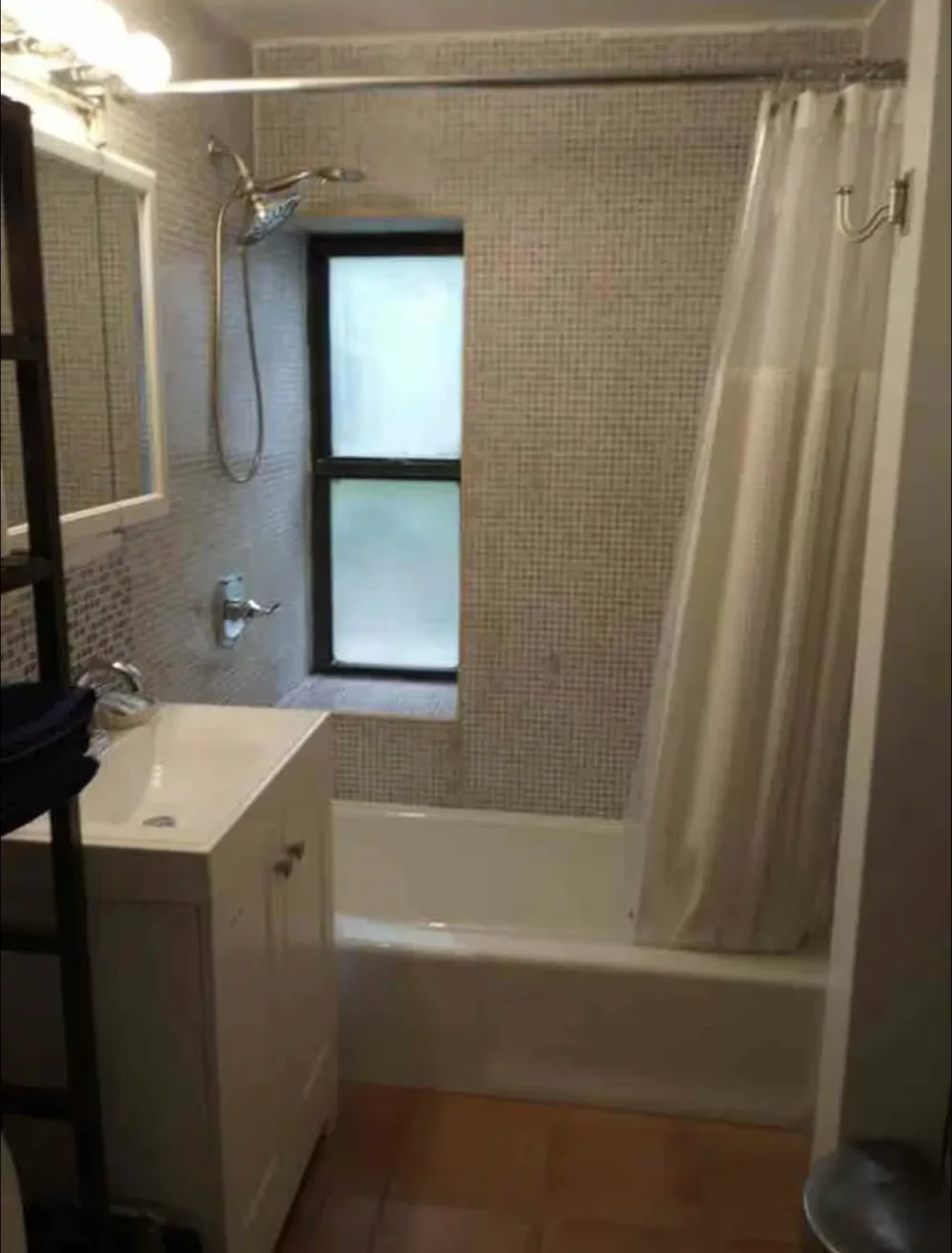 Modern bathroom with bathtub and window.
