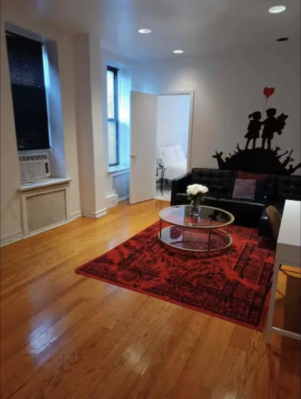 Modern living room with red rug