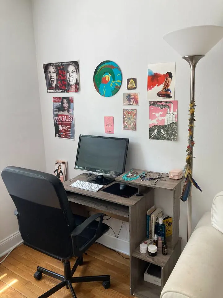 Cozy desk with artistic decor.