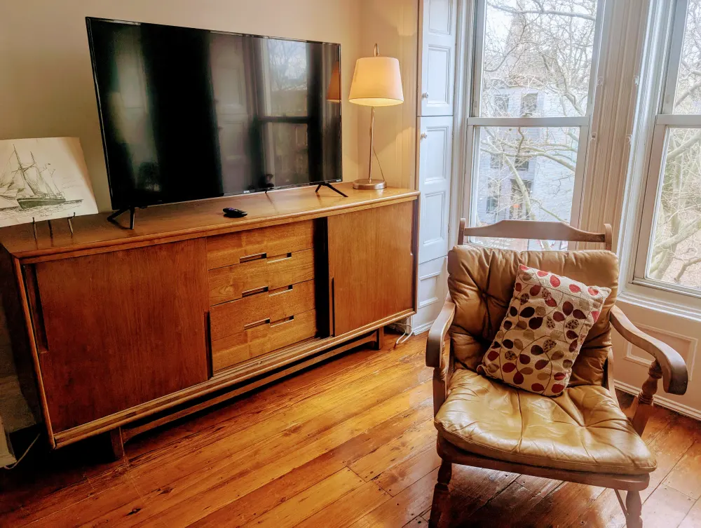 Cozy reading nook with sunlight.