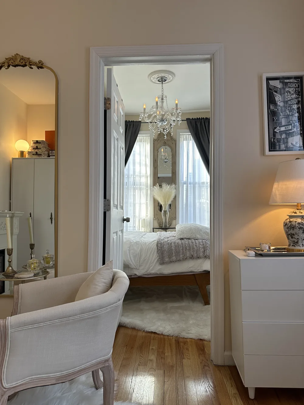 Elegant bedroom with chandelier lighting.