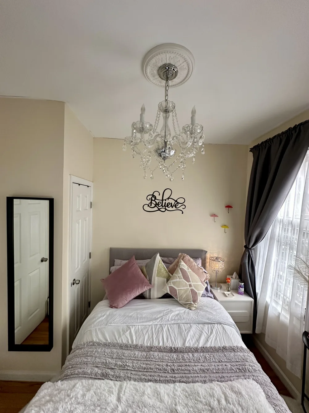 Cozy bedroom with decorative pillows.