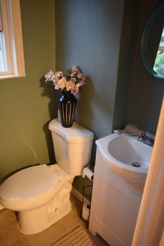 Small bathroom with toilet, sink.