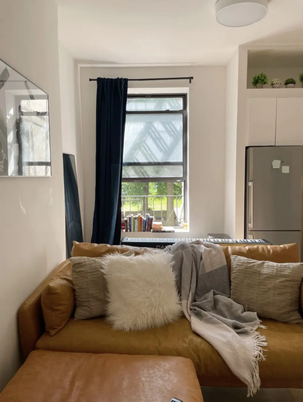 Cozy living room, large window.