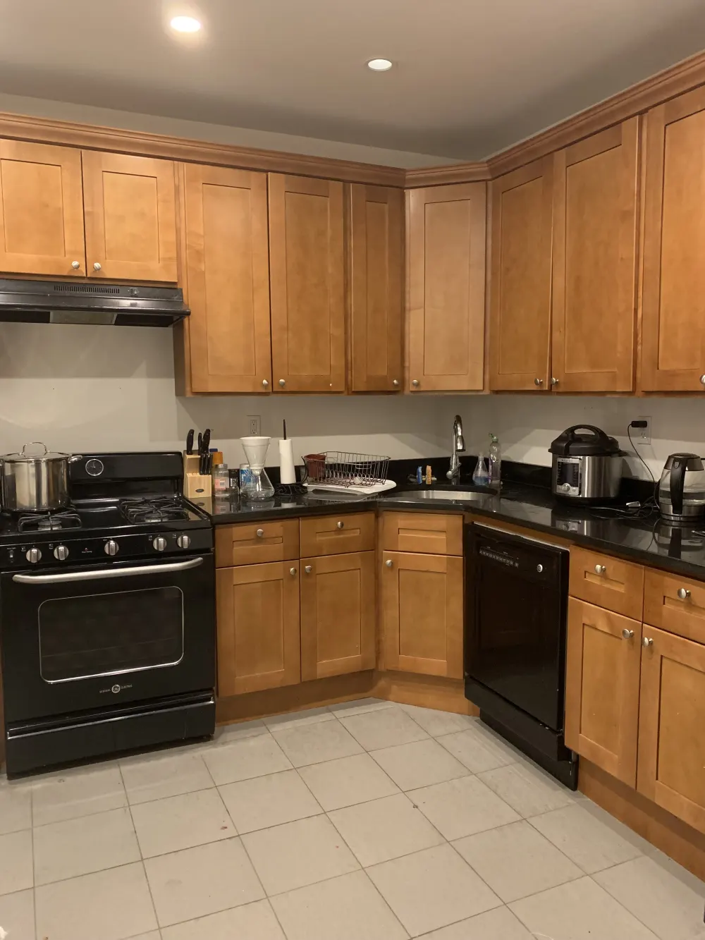Spacious kitchen with wooden cabinets.