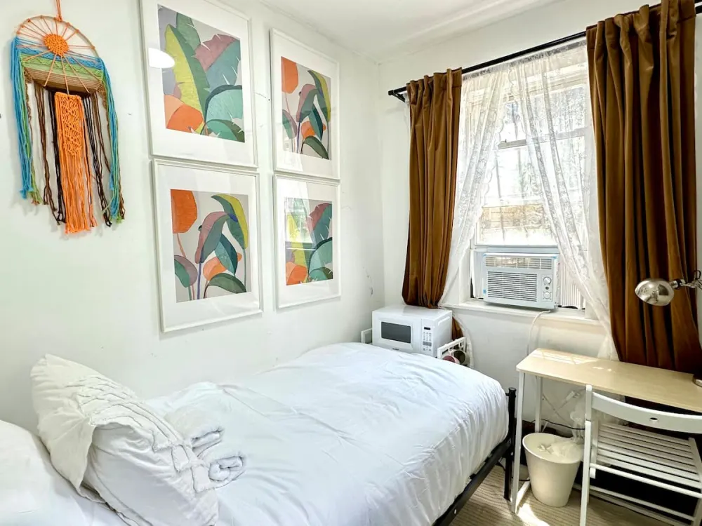 Cozy bedroom with colorful decor.