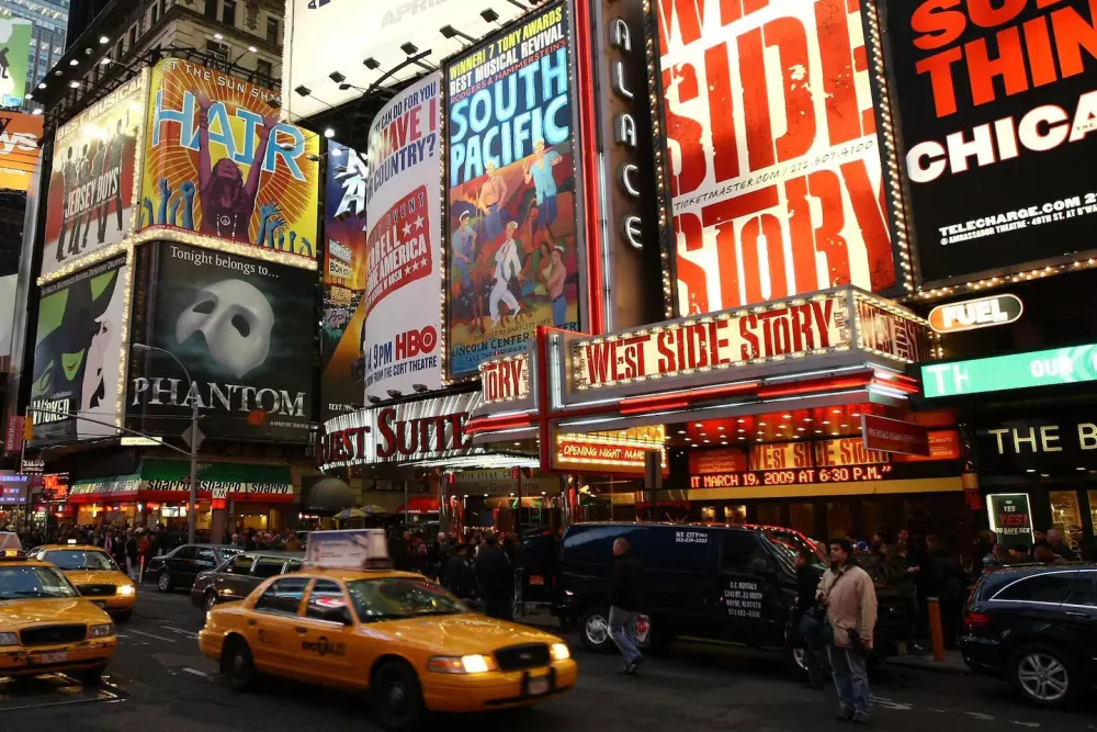Times Square with bright theater advertisements.