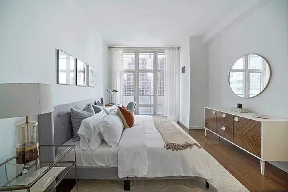 Modern bright bedroom with windows