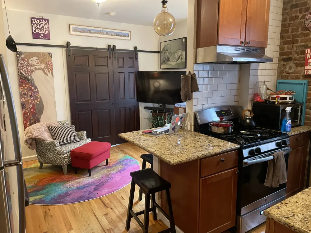 Colorful kitchen and cozy seating area.
