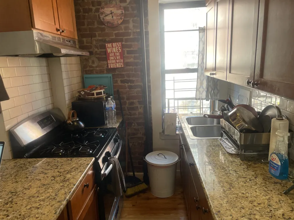 Charming kitchen with exposed brick.