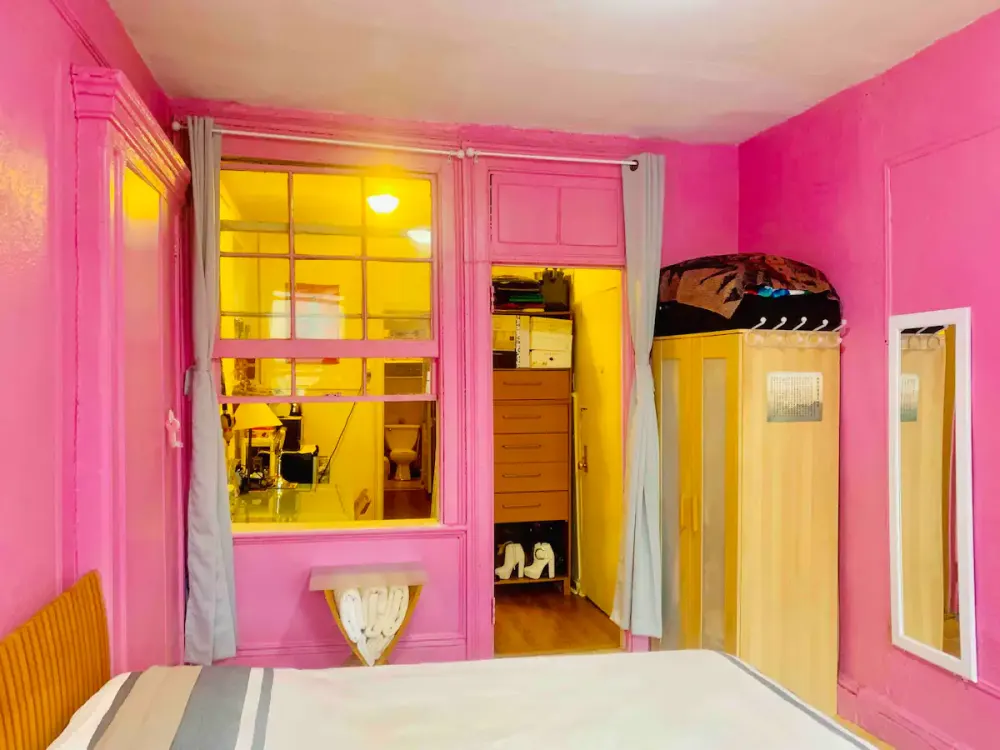 Bright pink room with yellow lighting