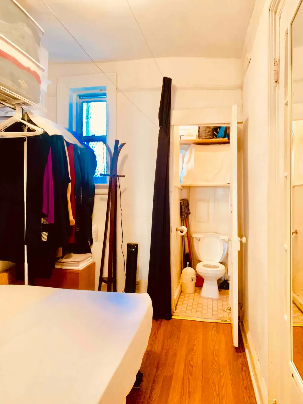 Cozy room with adjacent bathroom.