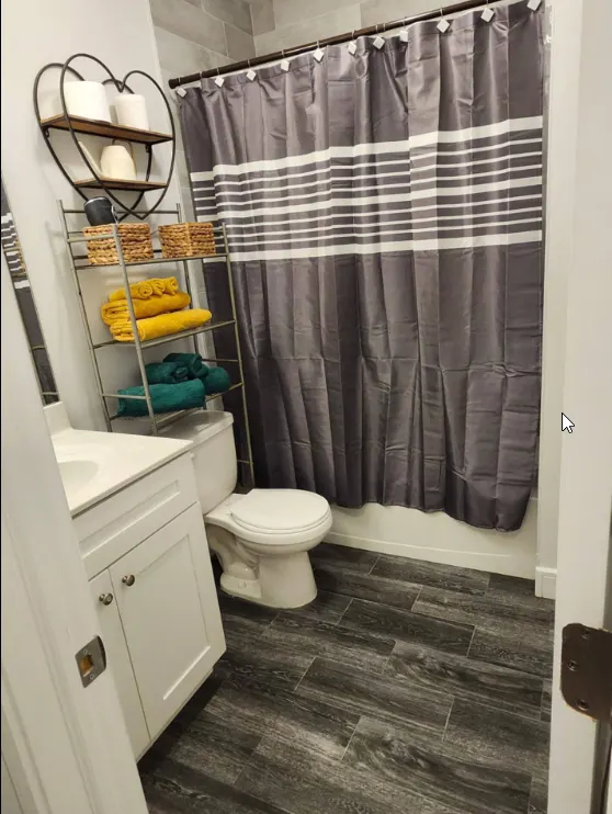 Modern bathroom with colorful towels.