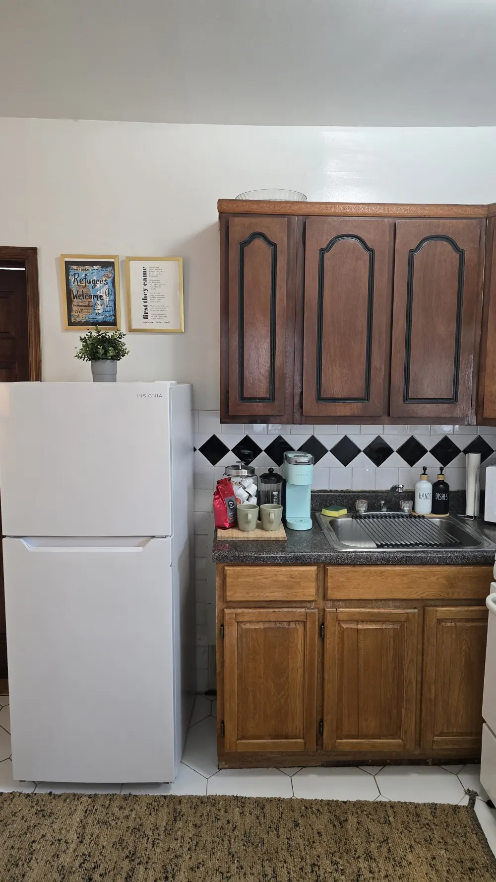 Cozy kitchen with wooden cabinets.