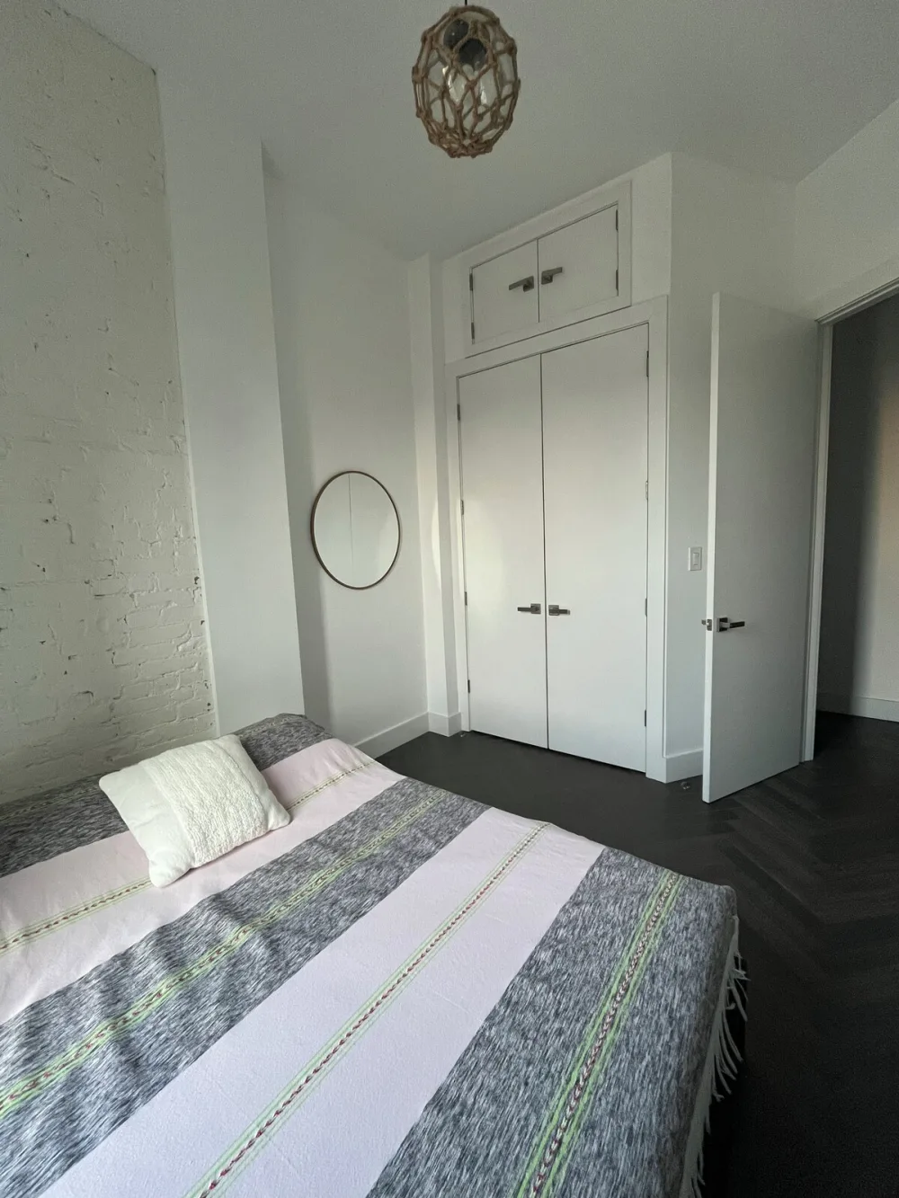 Cozy minimalist bedroom with bed