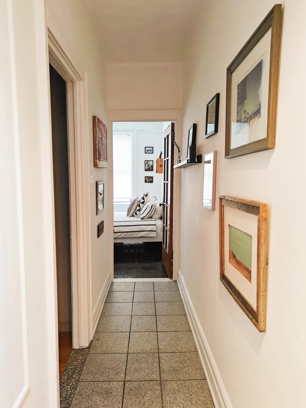 Hallway leading to cozy bedroom.