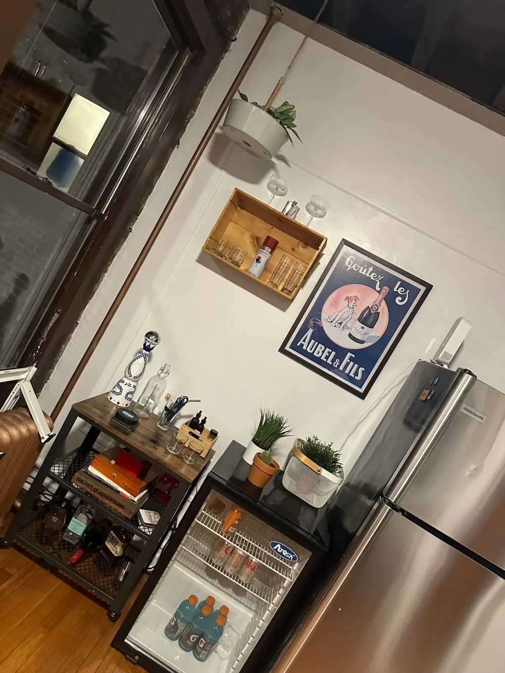 Small kitchen corner with fridge.