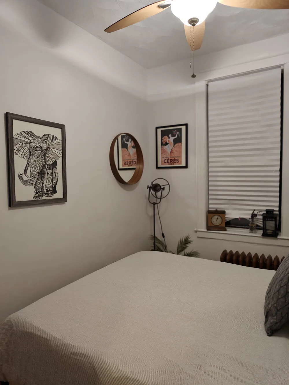 Cozy bedroom with artistic decor.