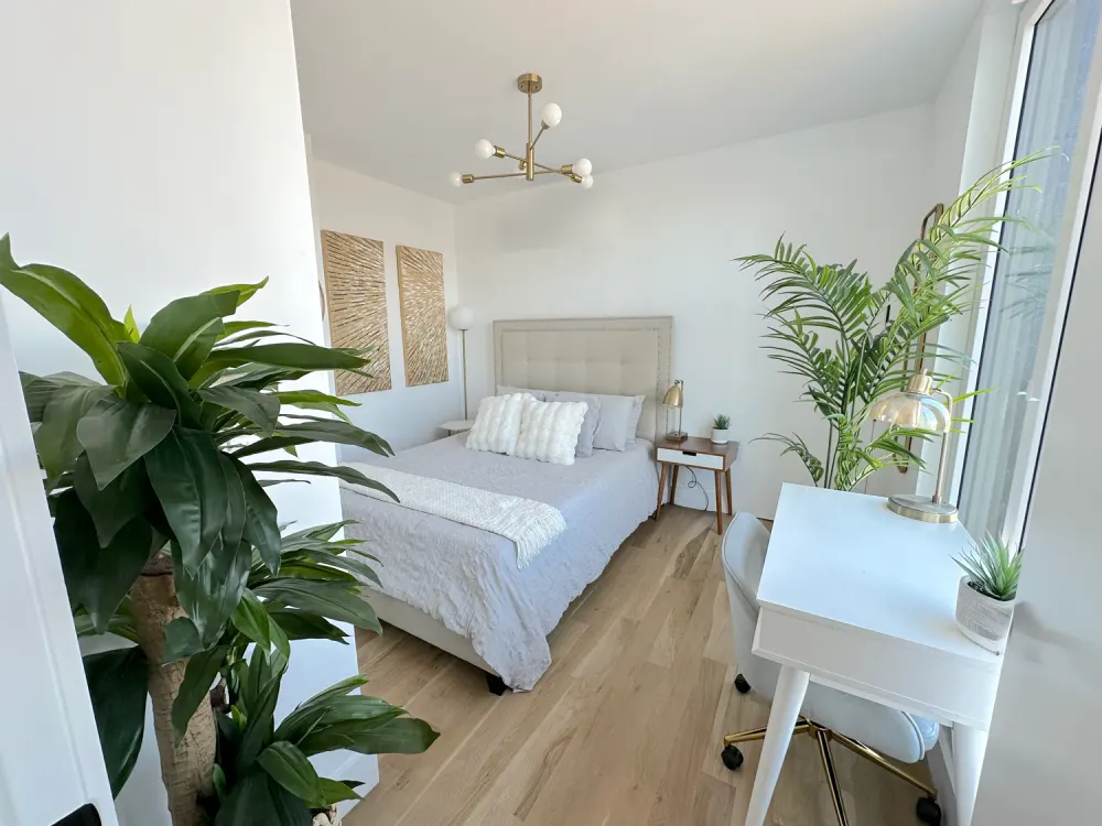 Bright, modern bedroom with plants.