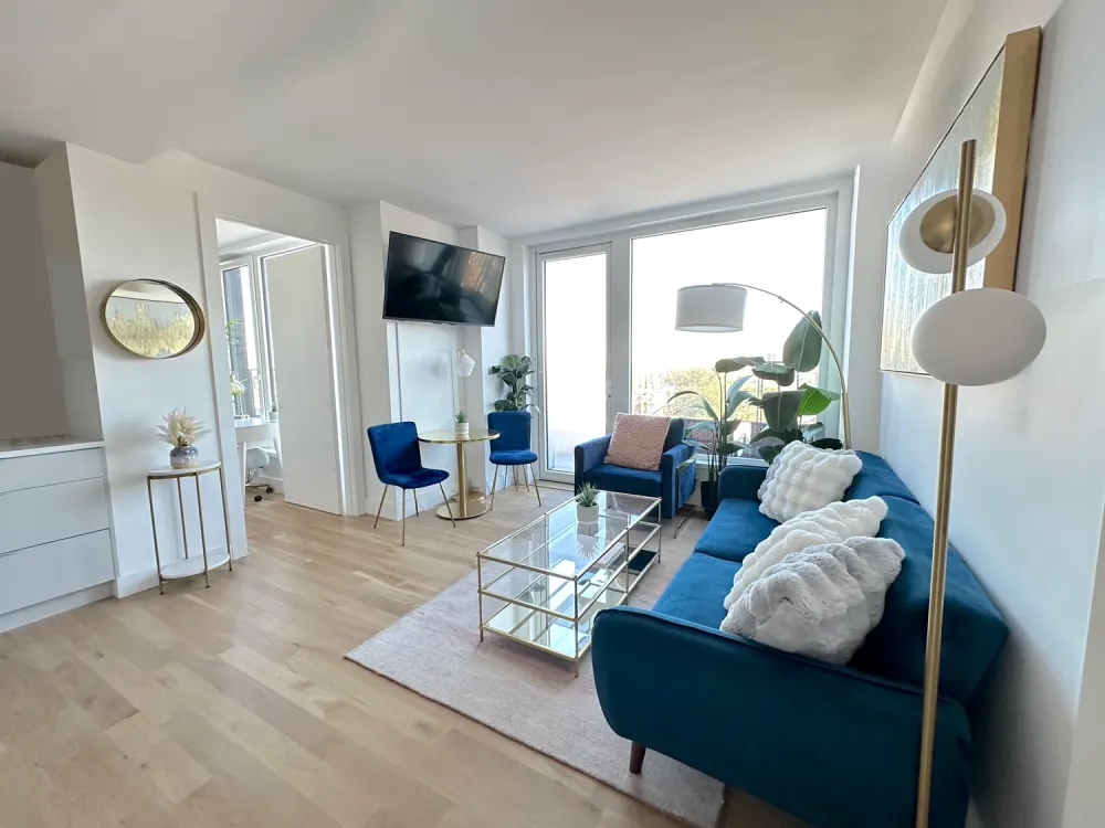 Modern living area with blue furniture.