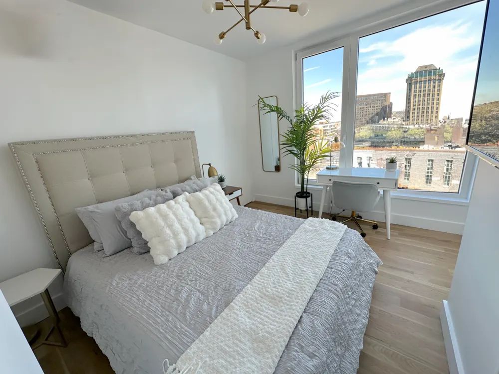 Modern bedroom with urban view.