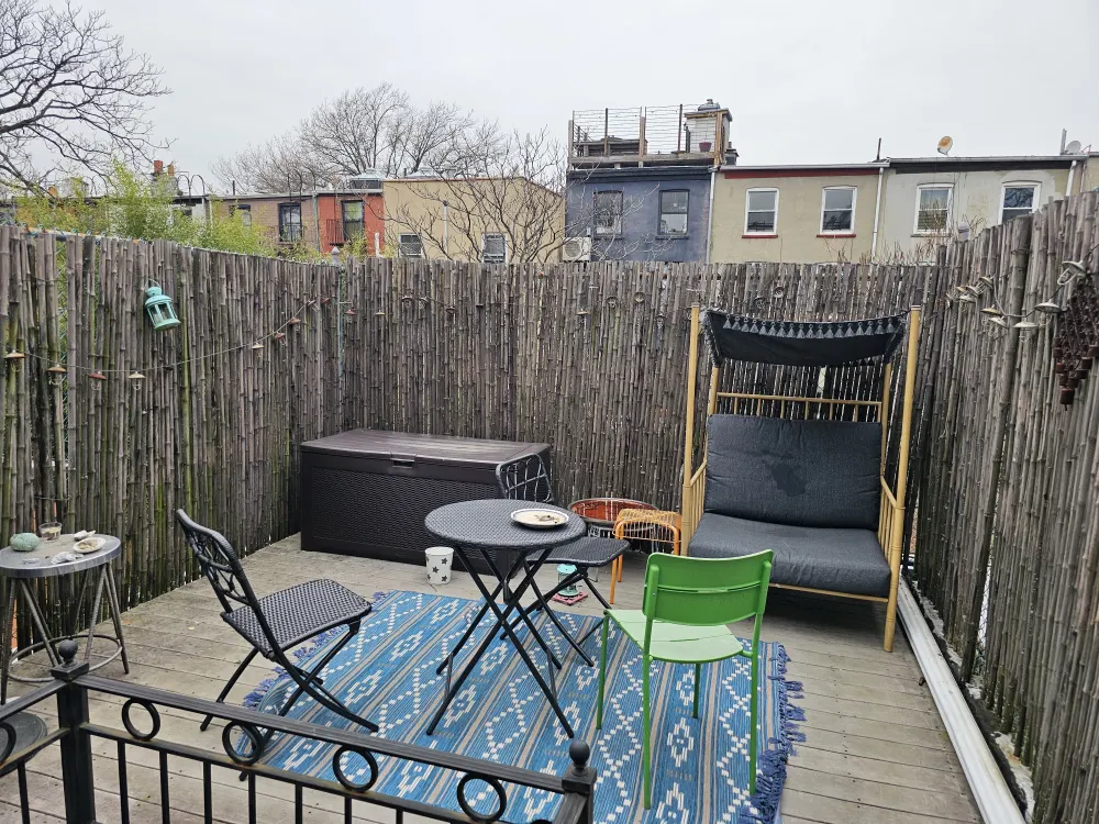 Cozy rooftop patio with seating.