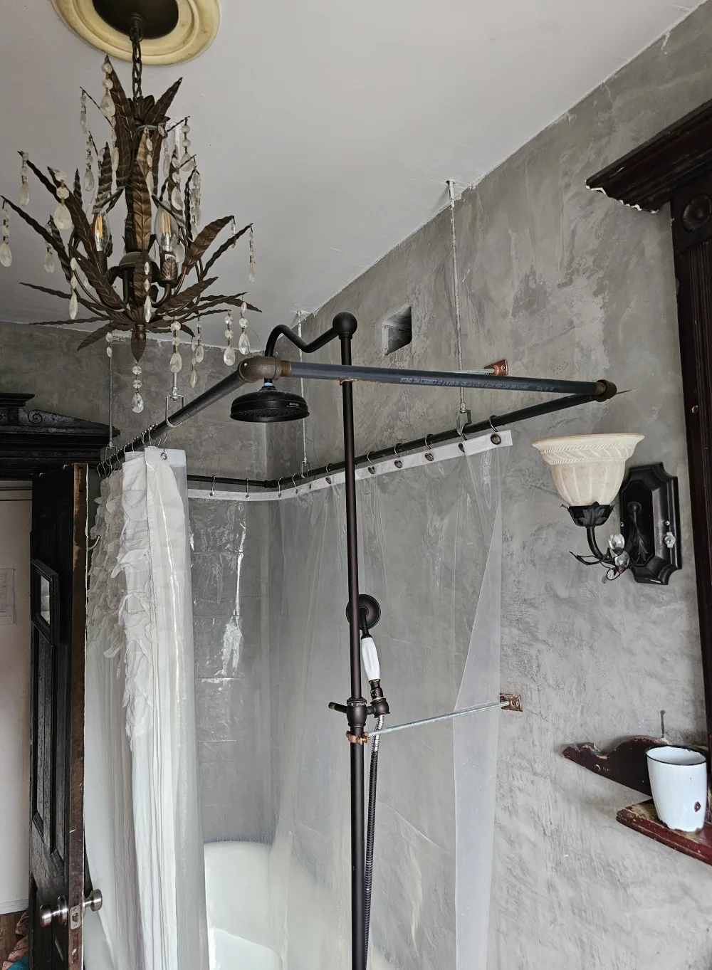 Vintage bathroom with chandelier lighting.