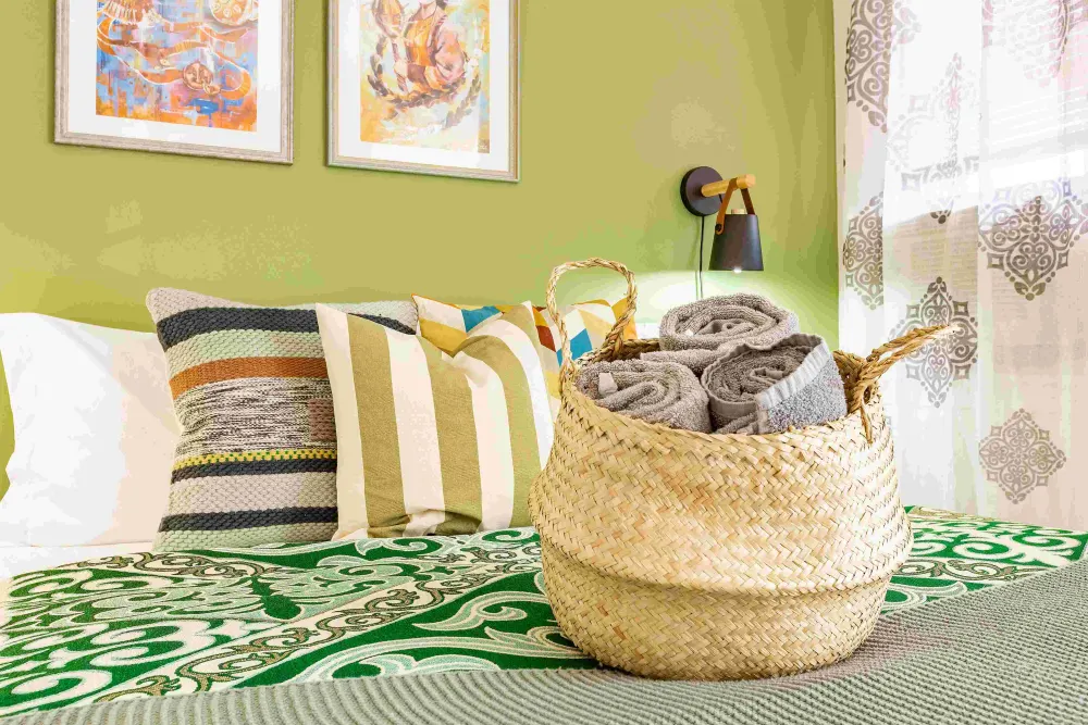 Cozy bedroom with decorative pillows.