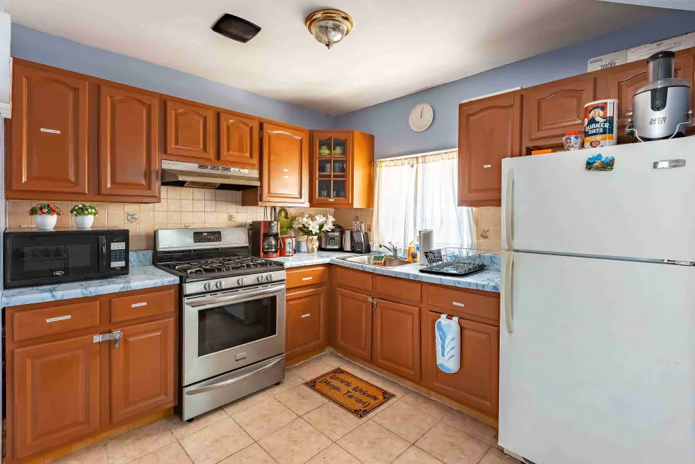 Cozy kitchen with wooden cabinets.