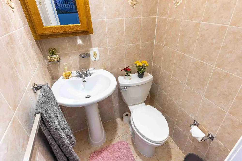 Cozy bathroom with floral decorations.