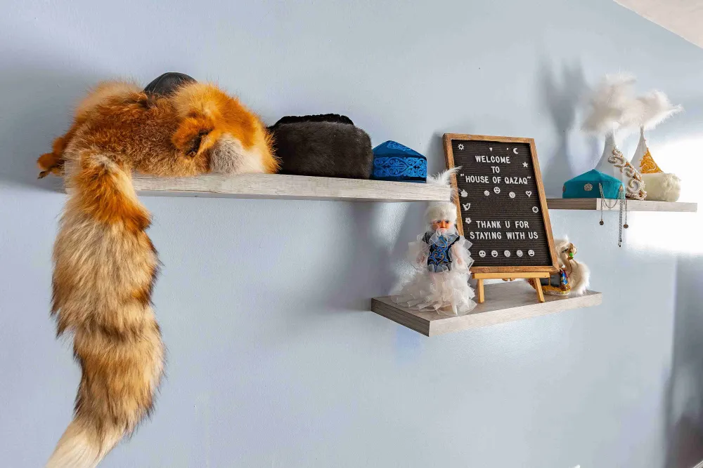 Traditional decorations on floating shelves.