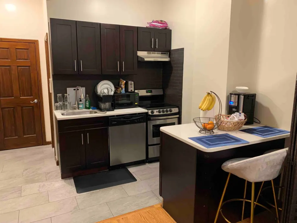 Modern kitchen with dark cabinets.