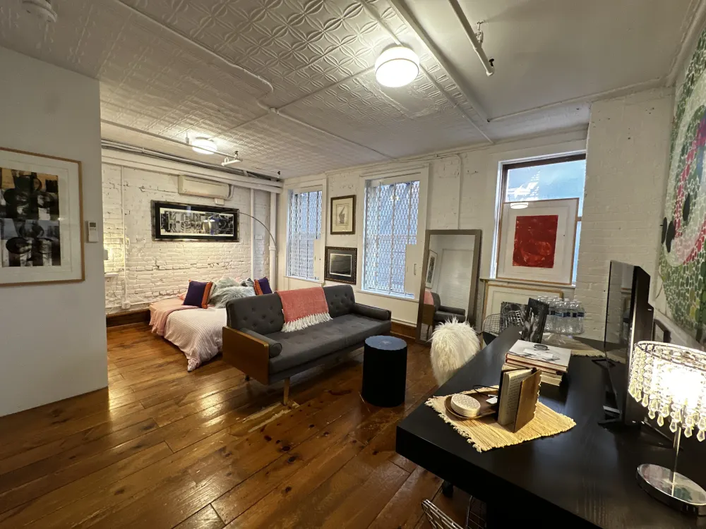 Cozy studio apartment with eclectic decor.