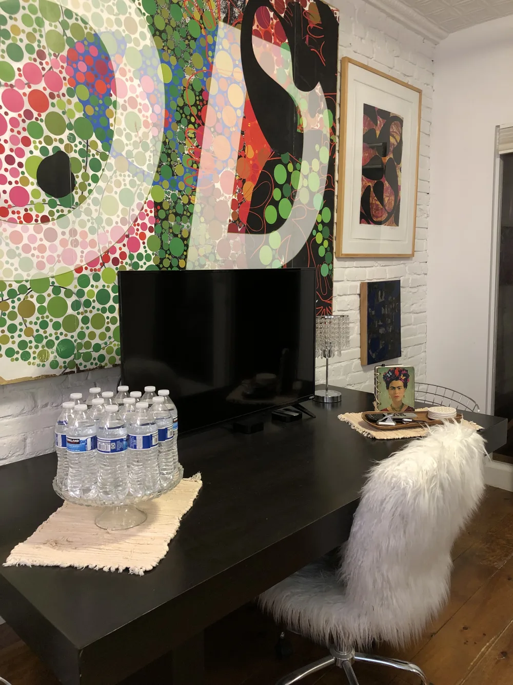 Eclectic workspace with colorful decor.