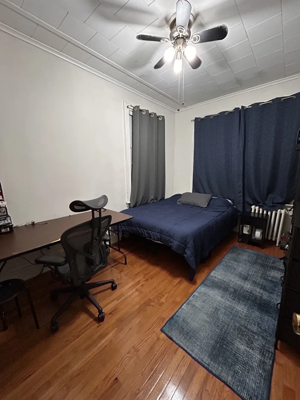 Cozy bedroom with desk area.