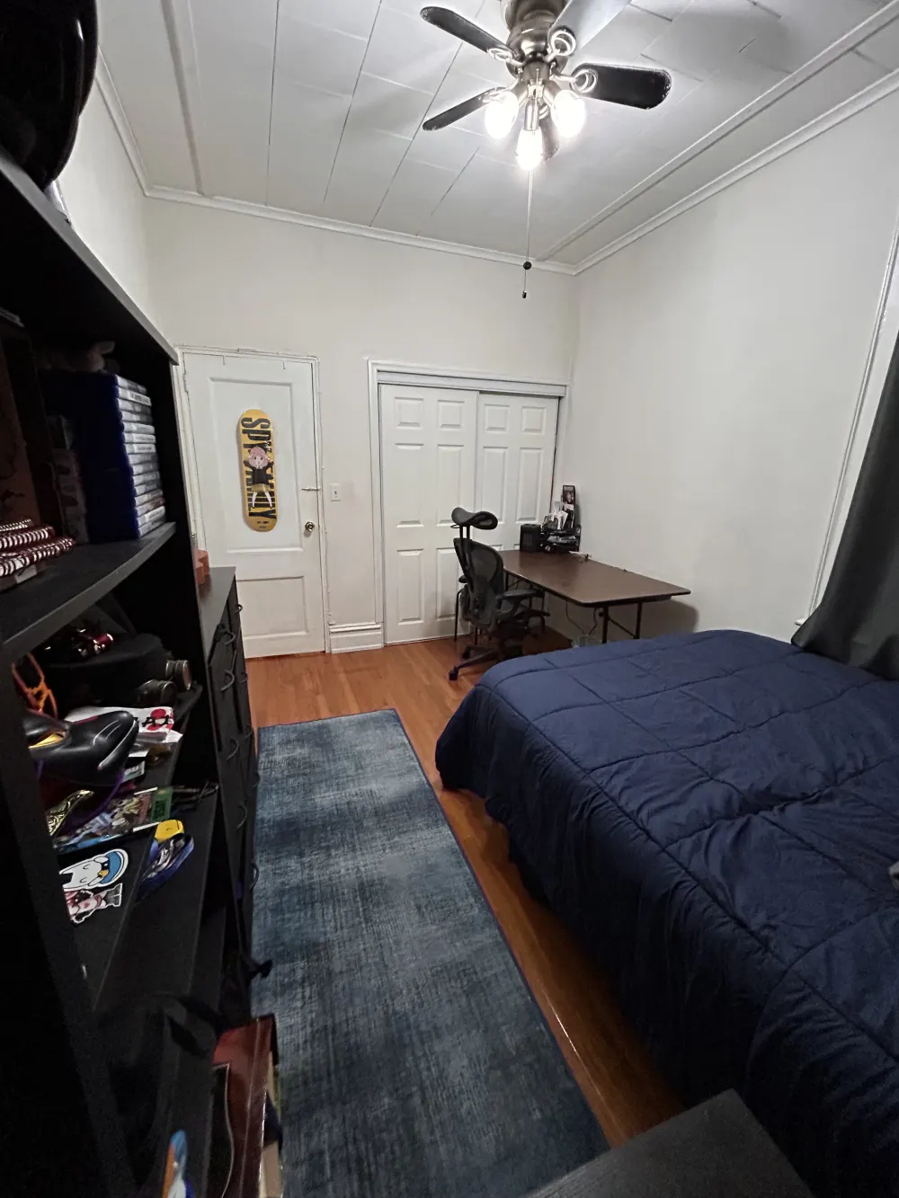 Cozy bedroom with desk setup.