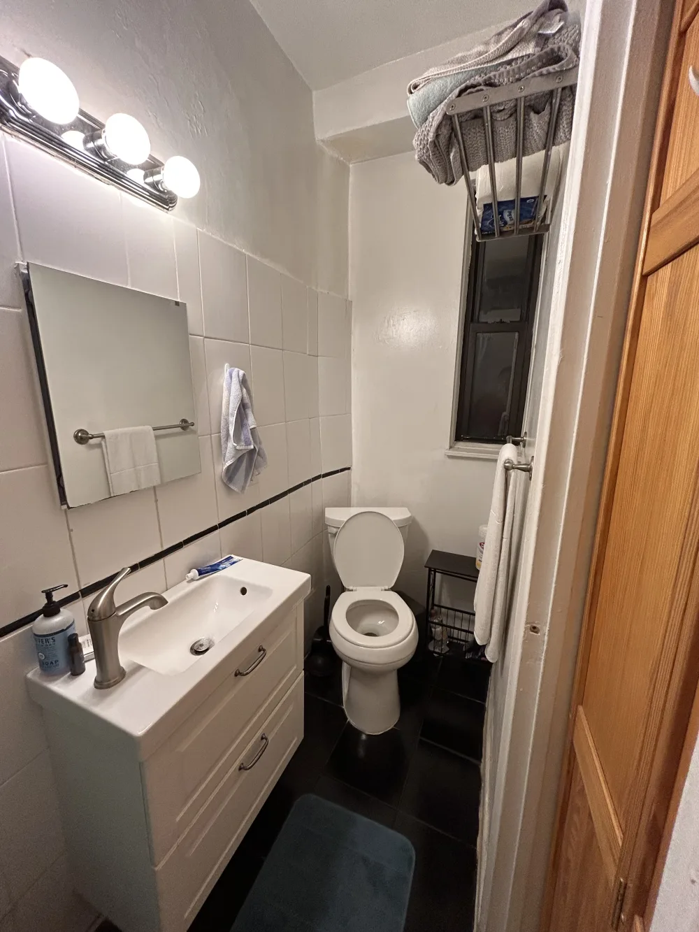 Small, clean bathroom with essentials.