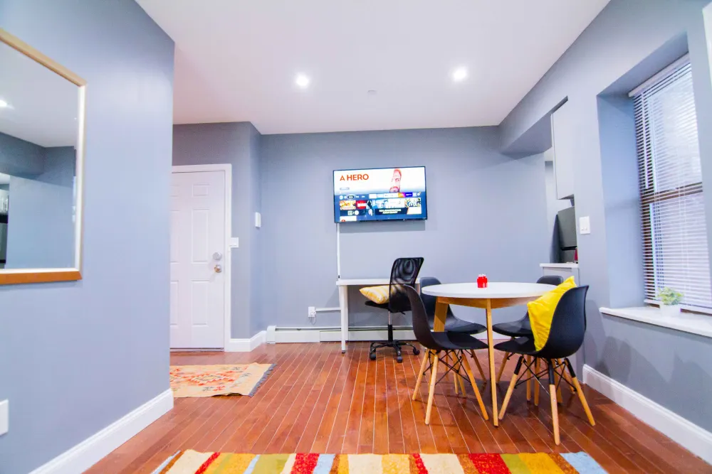 Modern dining area with television.