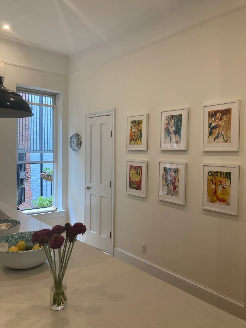 Modern kitchen with vibrant artwork.