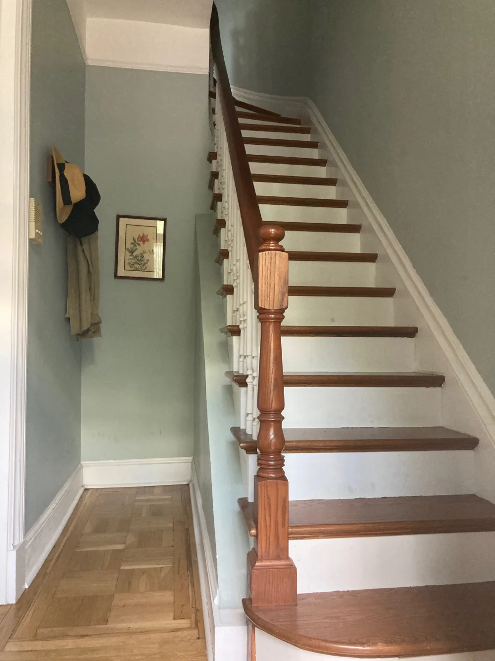 Classic wooden staircase with decor.