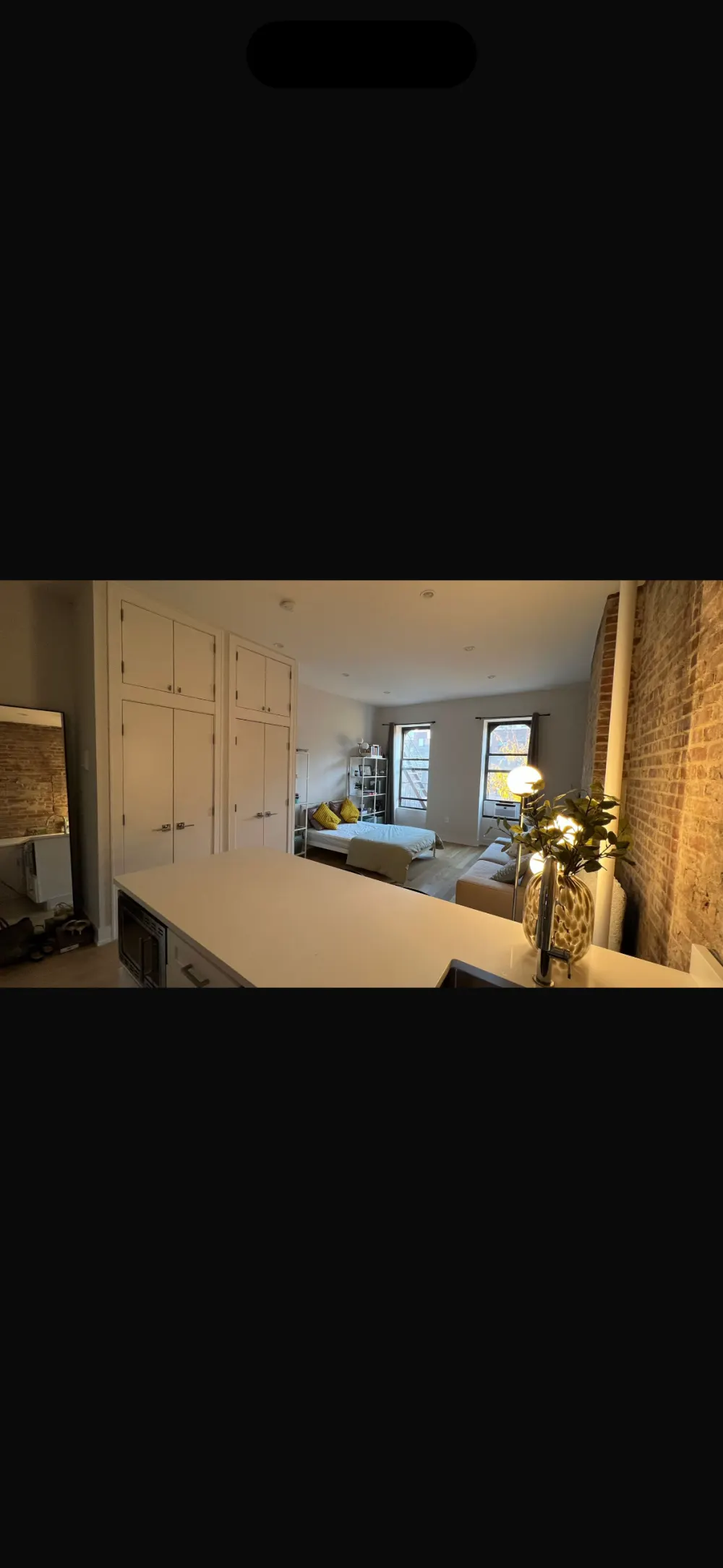 Modern studio apartment with cozy decor.