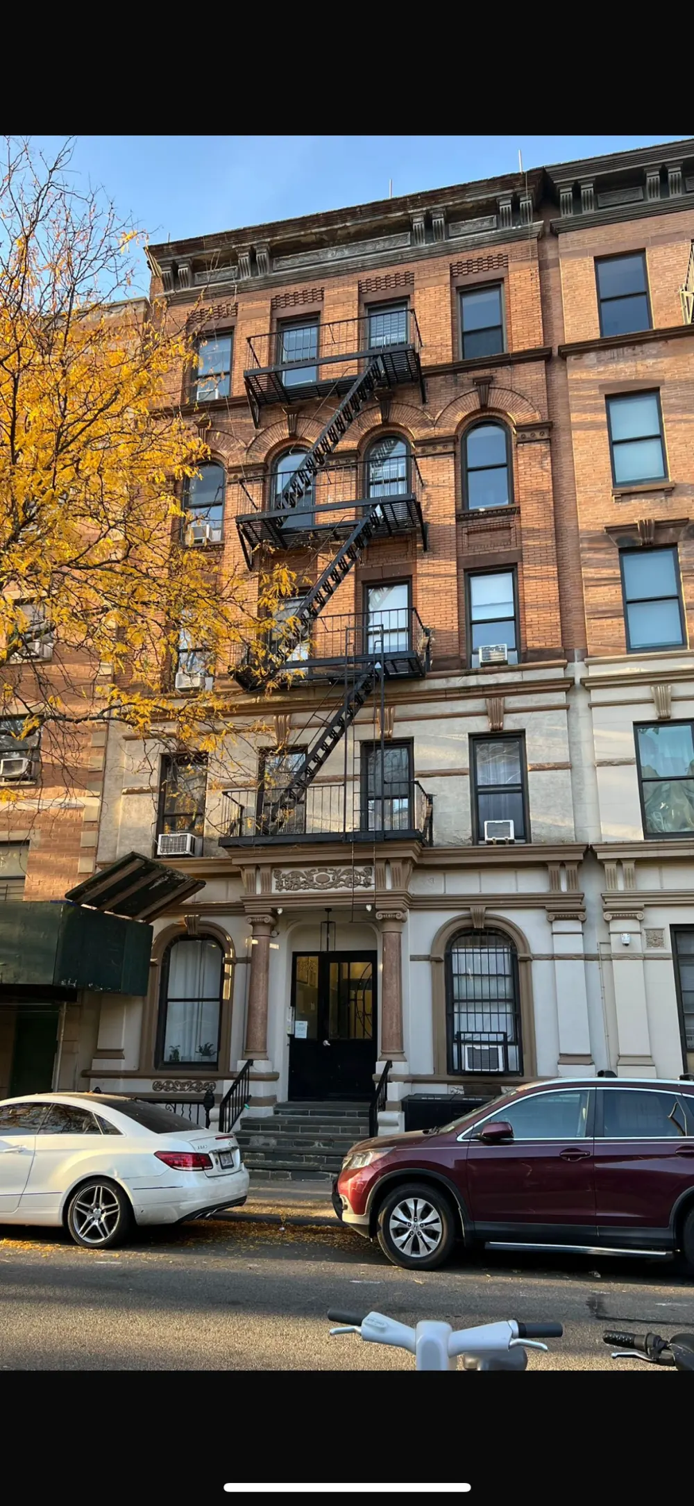 Historic brownstone with fire escapes.