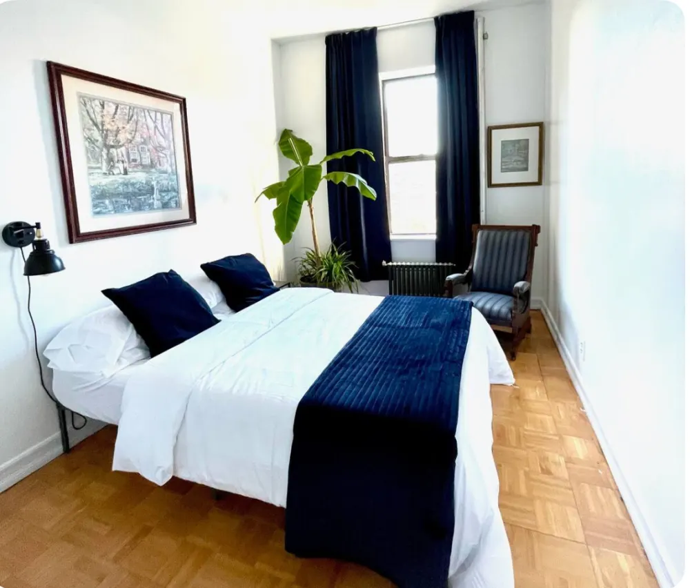 Bright bedroom with blue accents.