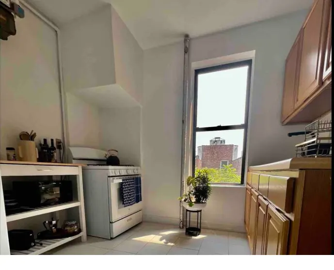 Bright kitchen with large window.