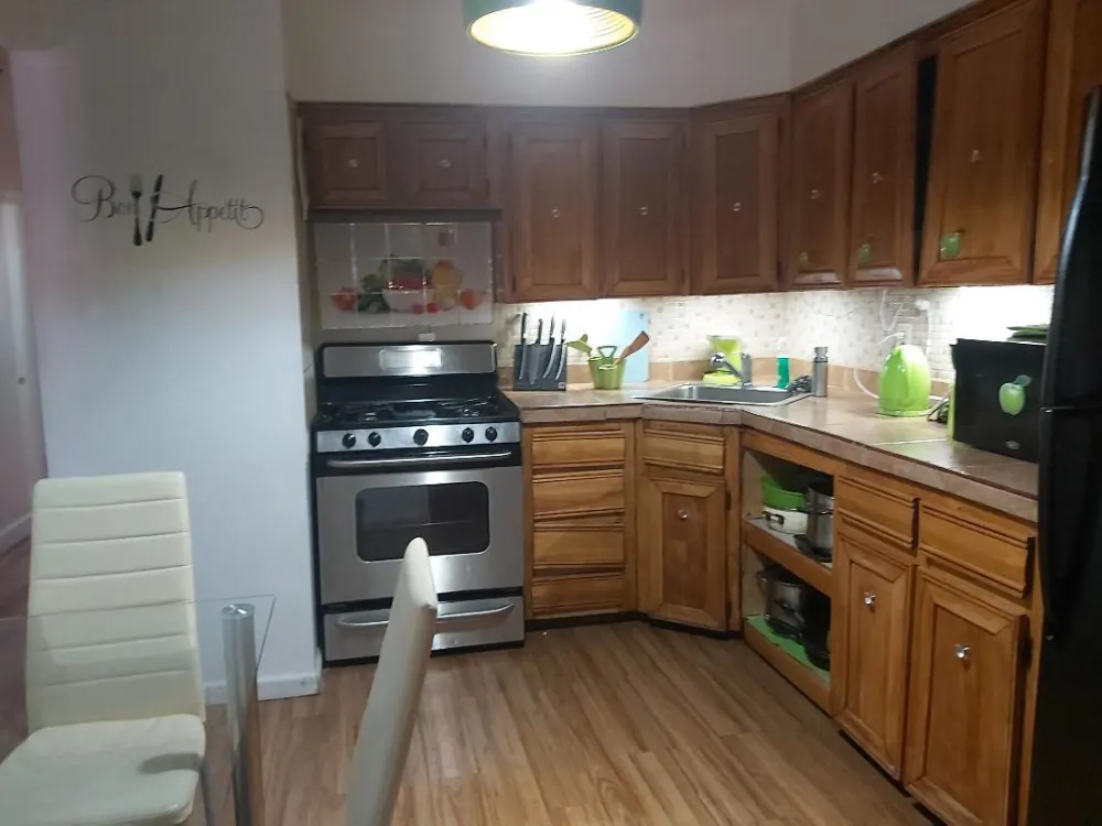 Cozy kitchen with wooden cabinets.