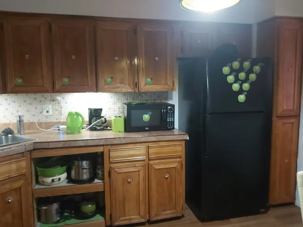 Cozy kitchen with wooden cabinets.